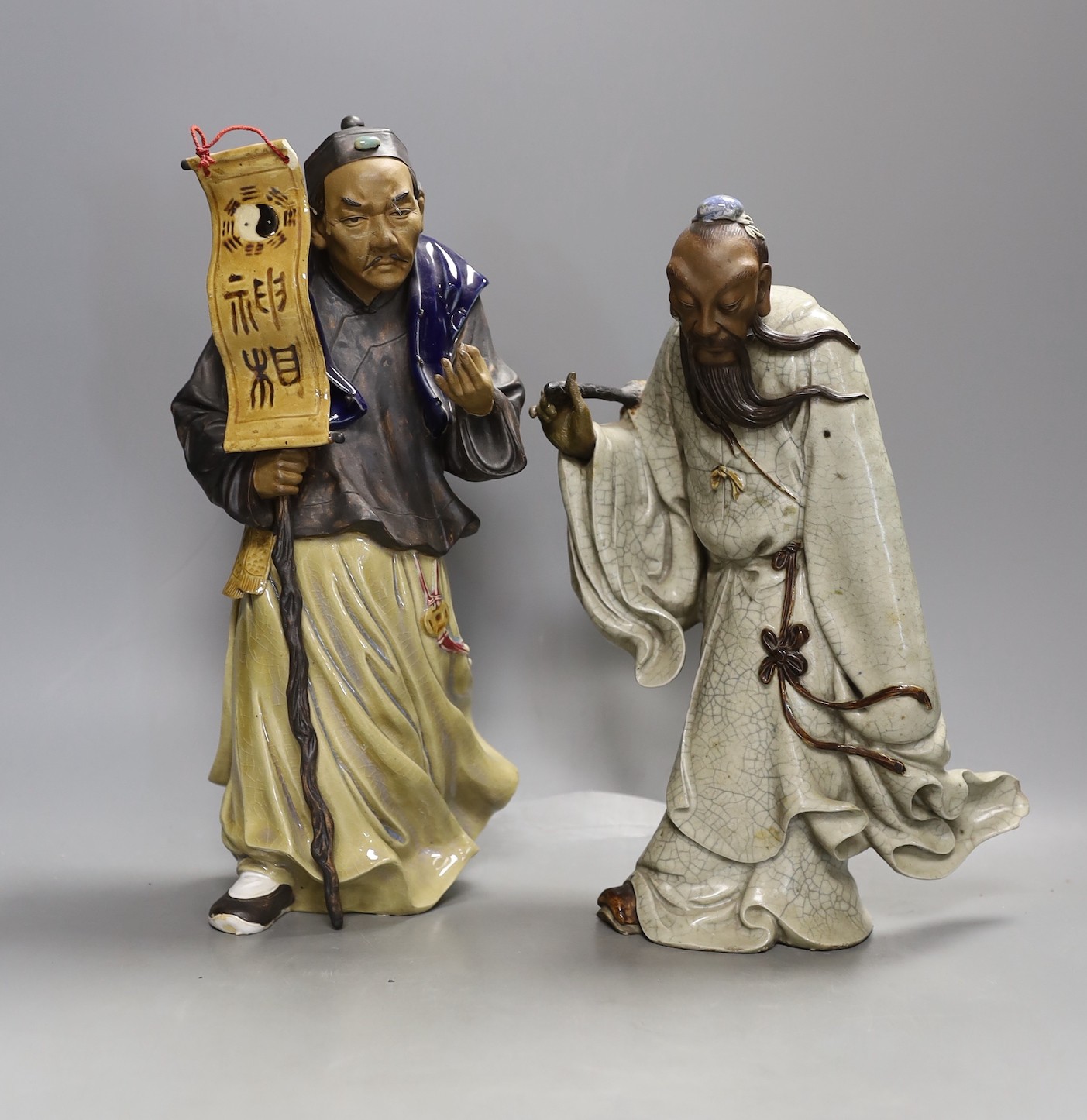 Two large Chinese Shiwan pottery figures of Lu Dongbin and an official - tallest 32cm